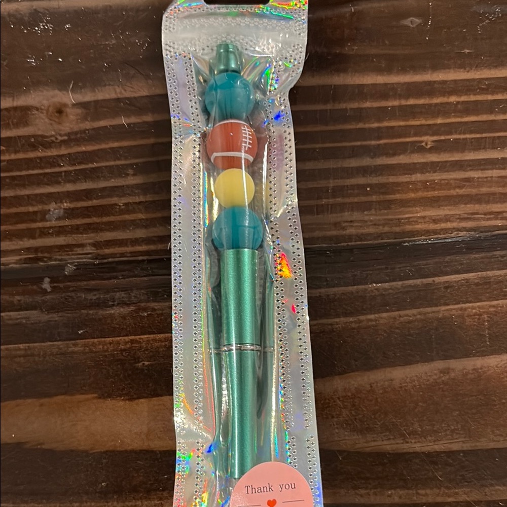 Green and yellow football glitter pen